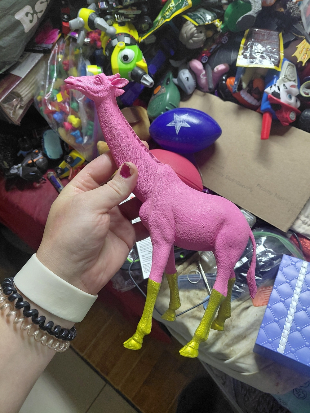 neon pink giraffe ornament by Talking Tables features textured skin and shiny go